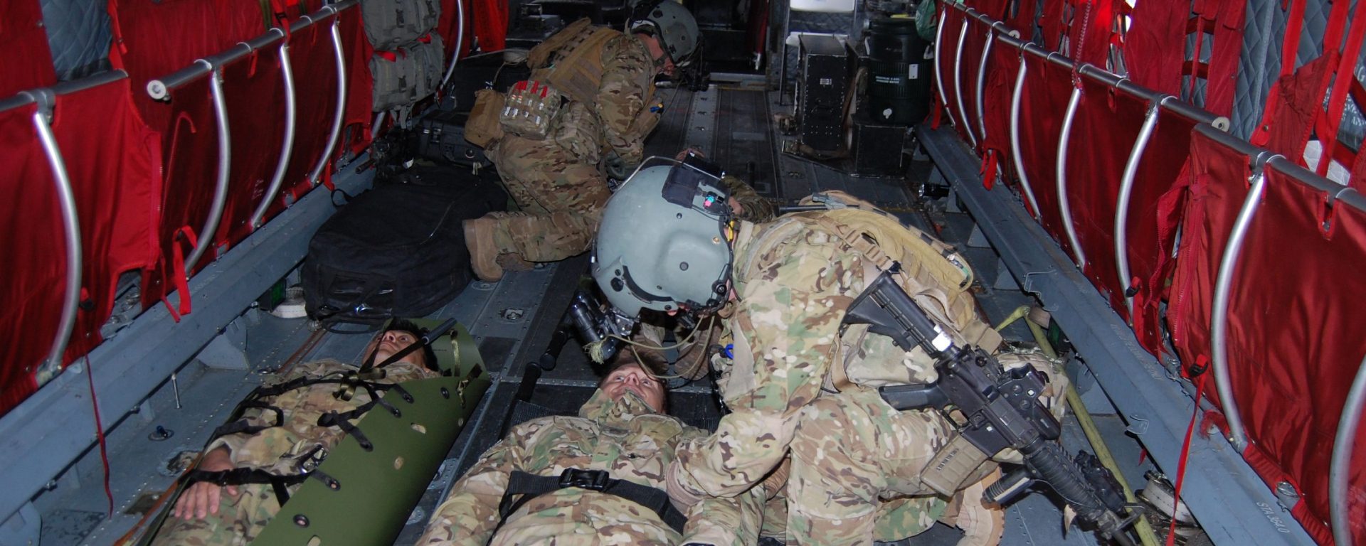 A group of soldiers laying on the ground.